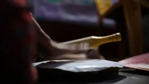 Close up of a woman preparing the Indian bread roti. Flat plane. Eye level Video stock 106286086