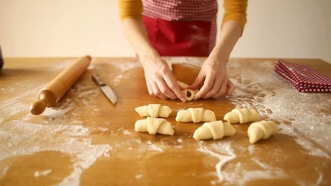 Close up of woman preparing rolls for baking Stock Footage 128259806