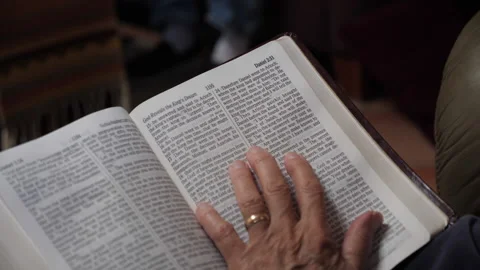 Close up of a woman reading a scripture at a Bible study meeting Stock Footage 230727120
