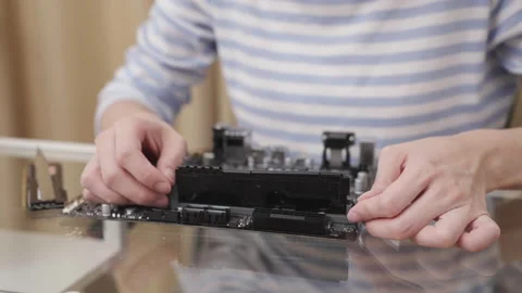 Close-up of a woman removing Random Access Memory (RAM). Stock Footage 172009152