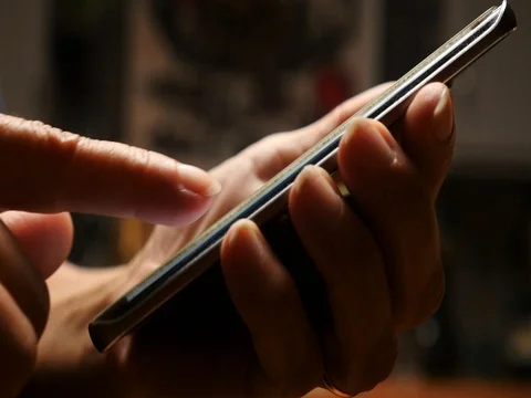 Close up of a woman sending a text message on a mobile smart phone Stock Footage 80613451