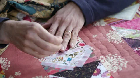 Close Up of Woman Sewing A Quilt Stock Footage