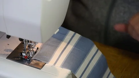 Close up of a woman sewing using a machine Stock Footage 101436626