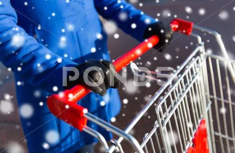 Close up of woman with shopping cart on street Stock Photos