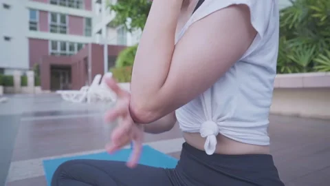 Close up woman sit down on exercise mat having problem with elbow, touch feel 스톡 동영상 141171083