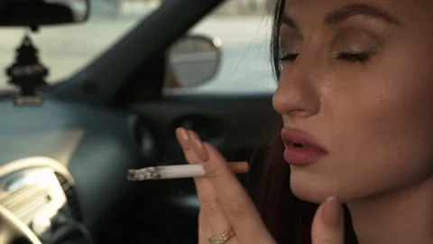 close-woman-smoking-car-footage-135952682_iconl.jpeg