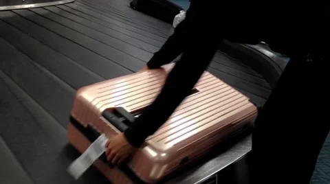 Close up woman taking her luggage inside YVR Airport. Stock Footage