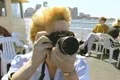 Close up of woman taking photos on tour boat Footage