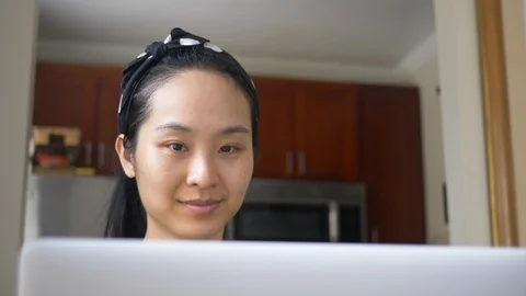 Close up Woman talking over computer Stock Footage 128405915