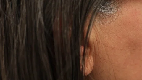 Tucking Hair Behind Her Ear - Stock Video | Motion Array