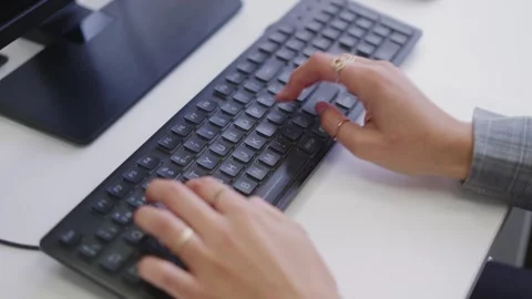 Close-up of woman typing on black computer keyboard Stock Footage 324756033