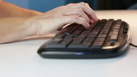 Close up woman typing at computer keyboard working from home Stock Footage 143075900