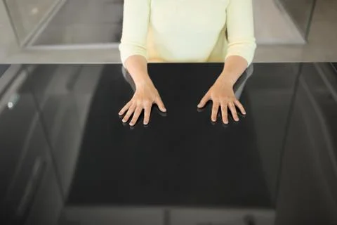 Close up of woman using black interactive panel Stock Photos
