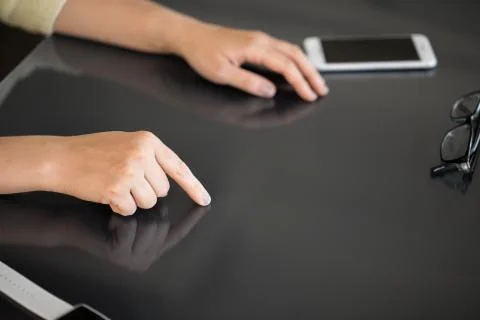 Close up of woman using black interactive panel Stock Photos