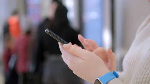 Close up of Woman Using Mobile Smart Phone in Shopping Mall Video stock 236347614