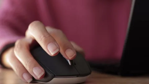 Close Up of Woman Using Mouse and Laptop Computer at Desk Stock Footage 331925987