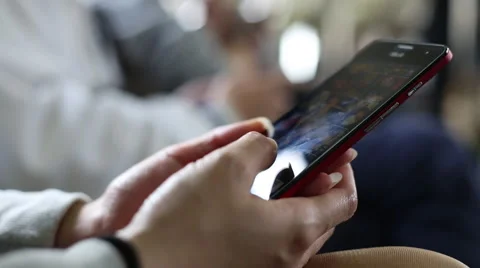Close Up Of Woman Using Smart Phone In Subway do some quick text messaging-Dan Stock Footage 47458184