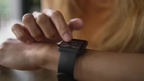 Close Up Of Woman Using Smart Watch Sitting At Table In Cafe Stock Footage 198296687
