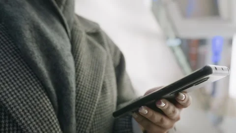 Close Up of Woman Using Smartphone in Elevator Stock Footage 310148060