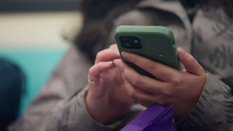 Close-up of woman using smartphone inside metro train in Taipei Stock Footage 312408077