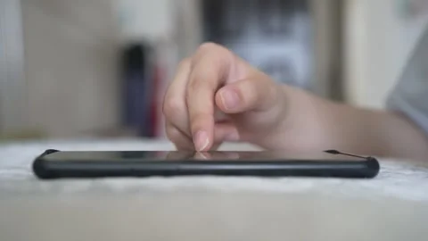 Close up of a woman using smartphone on sofa, browsing internet and scrolling Stock Footage 309617717