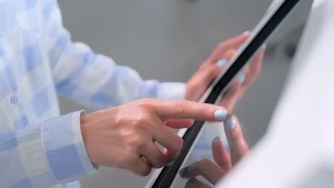 Close up: woman using touchscreen display of interactive kiosk at exhibition Stock Footage 162691549