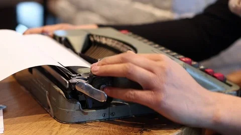 Close up on woman using typing machine Stock Footage 72275910