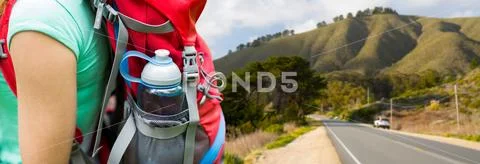 Close up of woman with water bottle in backpack Stock Photos