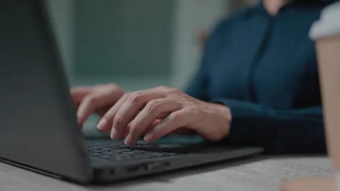Close-up woman working on computer using touchpad typing company messages commun Video stock 262849863