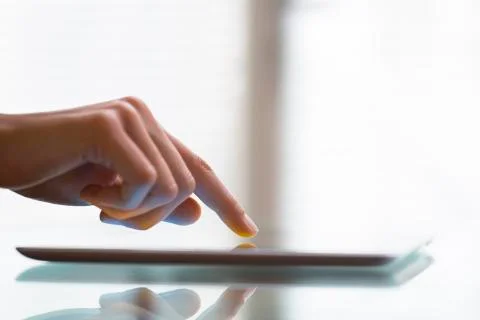 Close-up of woman working with digital tablet pc Stock Photos