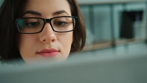 Close up woman working with laptop computer in the office. Atractive woman in Video stock 75765012