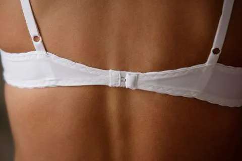 Close up of woman's back, wearing bra strap Stock Photos