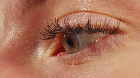 Close-up womans blinking eye with long eyelash and contact lens. Beauty make up Stock-Footage 286130561