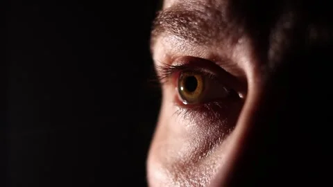 Close-up of a woman's eye in the dark Stock-Footage 347456842