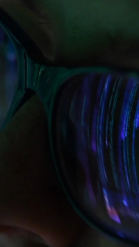 Close-up of a woman's eye in glasses with computer screen reflection. Stock Footage 258492219