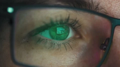 Close-up of a woman's eye looking at a computer screen Stock Footage 164435862