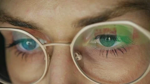 Close up of woman's eyes looking at computer screen Video stock 337830380