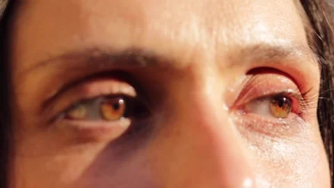 Close up of a woman's eyes in the sunlight Stock Footage 292911624