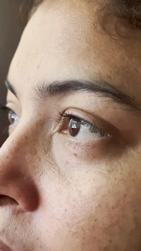 Close up of a woman's eyes while using a computer Stock Footage 347714645