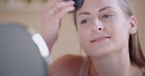 Close up of woman's face doing makeup Stock Footage 305066613