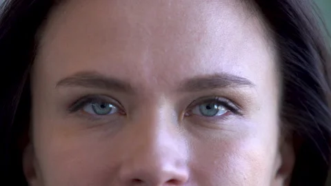 Close up of Woman's face. Female model with long eyelashes looking at camera Stock Footage 172338787