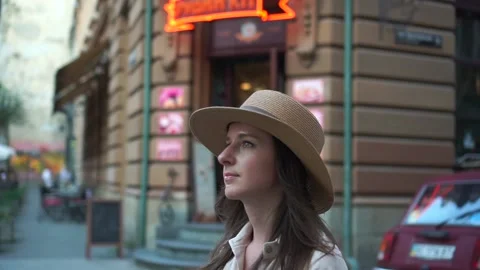 Close up of woman's face with hat outside the city street, slow motion Video stock 159502474