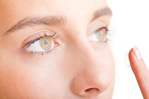 Close up of Womans Face Inserting a Contact Lens Stock Photos
