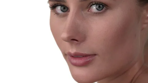 Close up of woman's face, looking from bottom to the camera while the camera Stock Footage 158001825
