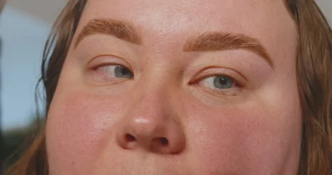 Close-up of a womans face. The procedure for coloring and shaping eyebrows Stock Footage 316143399