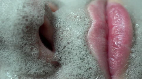 Close-up of a woman's face smeared with a carbonated bubble clay mask Stock Footage 143874134