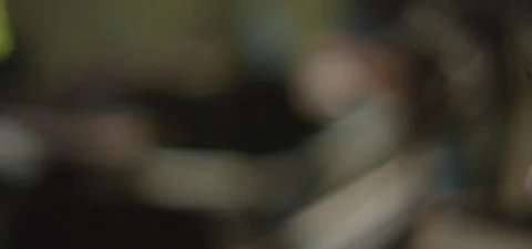 CLose-up of woman's face smiling as she looks into computer Stock Footage 75490617