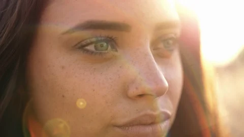 Close up of woman's face at sunset, beautiful green eyes, portrait, outdoor Stock Footage 109458161