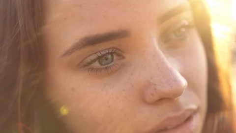 Close up of woman's face at sunset, beautiful green eyes, portrait, outdoor Stock Footage 109458285