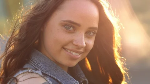 Close up of woman's face at sunset, beautiful green eyes, portrait , beautifil Stock Footage 109459187